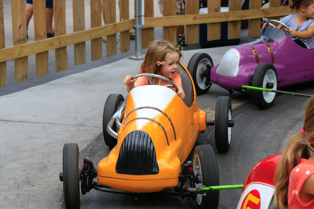 little girl on midge-o-racers