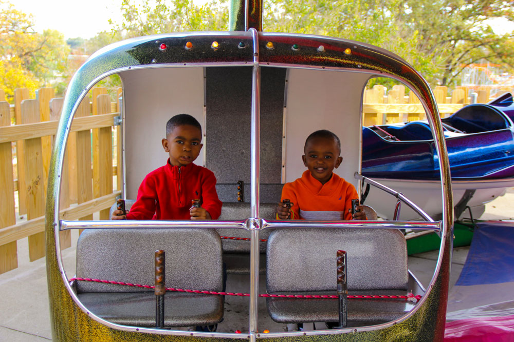 two boys on space invasion ride