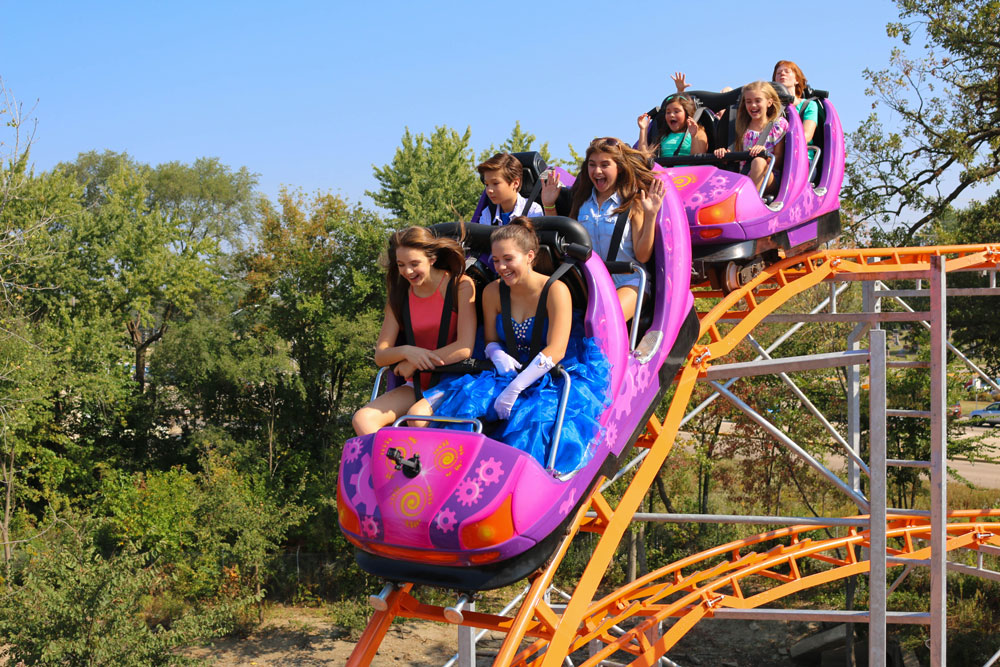 Guests Ride Super Cyclone Roller Coaster